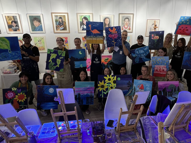 Big group at a neon paint and sip class